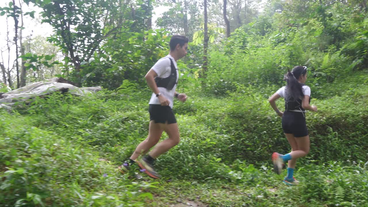 Couple Trail Running in Forest