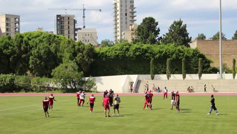 a football team practices on the athletic field at the american university of beirut in lebanon