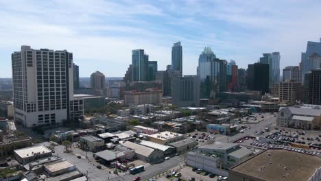 An-aerial-view-of-the-city's-many-parking-lots-and-garages,-illustrating-the-importance-of-finding-a-parking-spot-in-the-busy-downtown-area