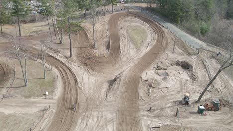 aerial fly over of dirtbike track berm shot at 4k 60p