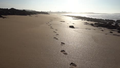 footprints on the sand in the atlantic coast