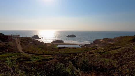 Still-shot-of-the-Sutro-Baths-remains-in-San-Francisco,-California-on-a-beautiful,-calm-summer-evening-with-sunset-approaching---4K
