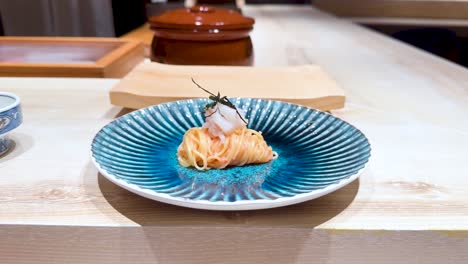 noodles served on a decorative blue plate