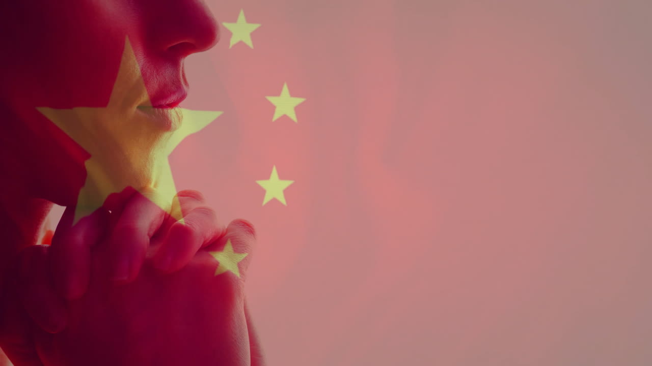 Chinese flag animation overlay on silhouette of person with contemplative expression