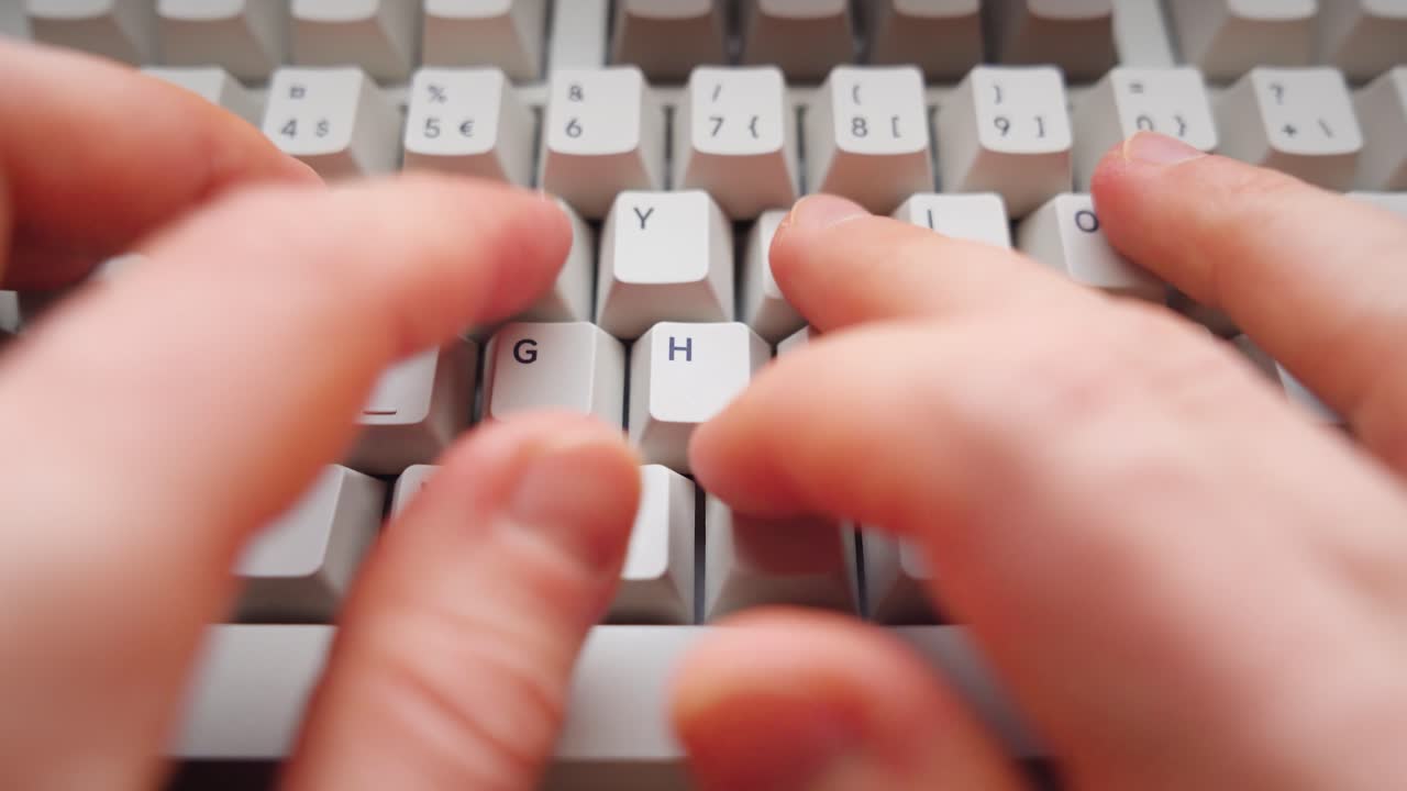 Man typing on a keyboard