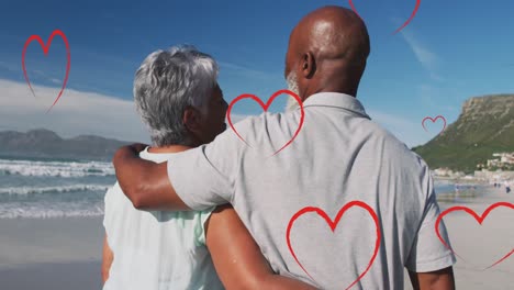 Animation-of-falling-hearts-over-african-american-couple