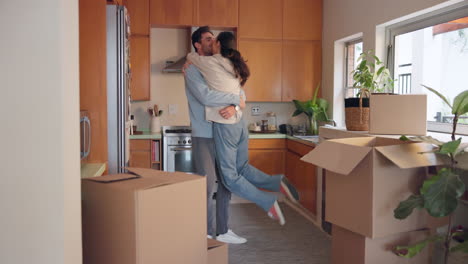 Hug,-couple-and-excited-in-new-home-to-celebrate