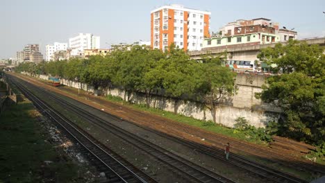 train tracks in urban bangladeshi cityscape