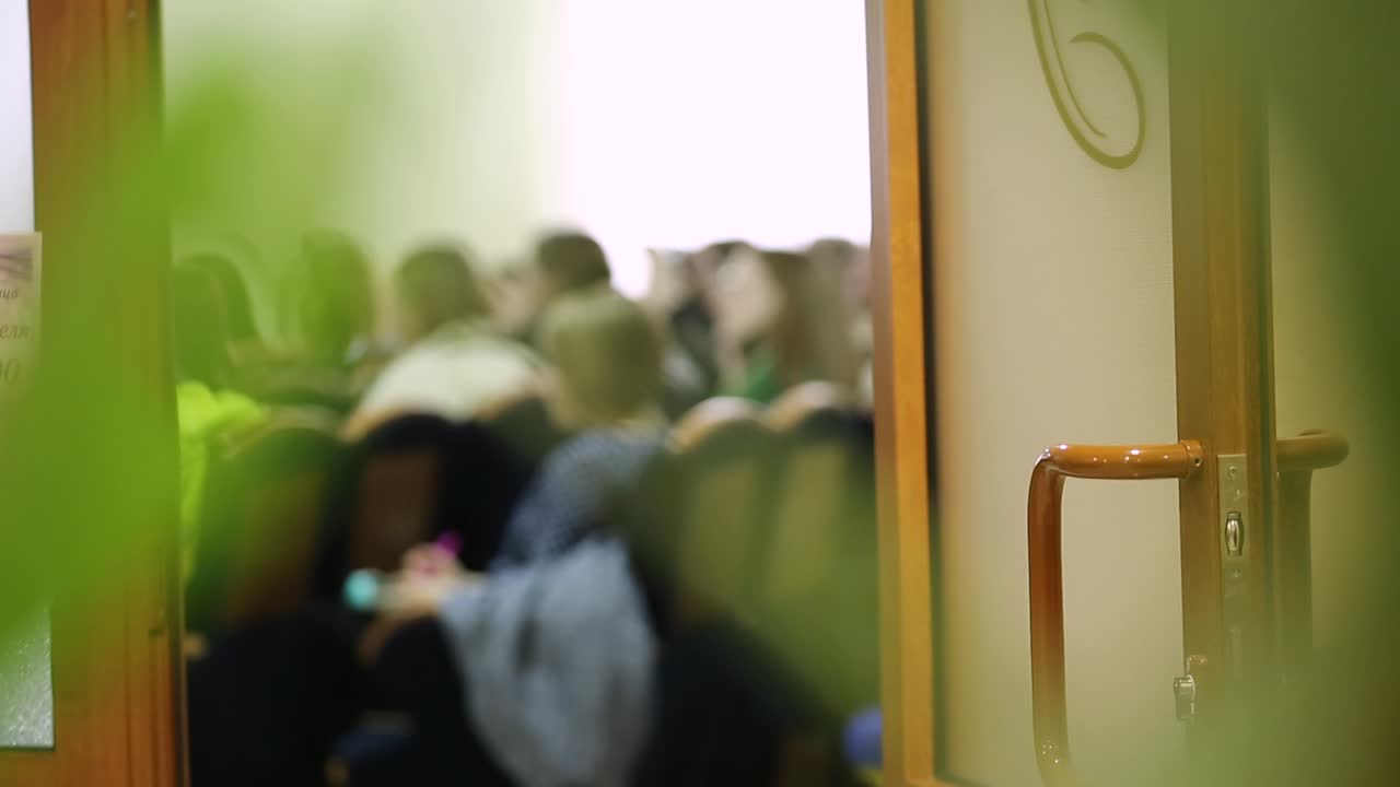Audience In The Lecture Hall. Education people and business people sitting in conference room