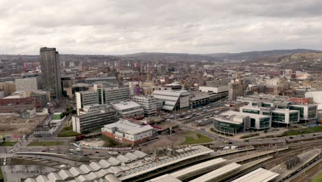 4k aerial footage above sheffield city centre and railway station