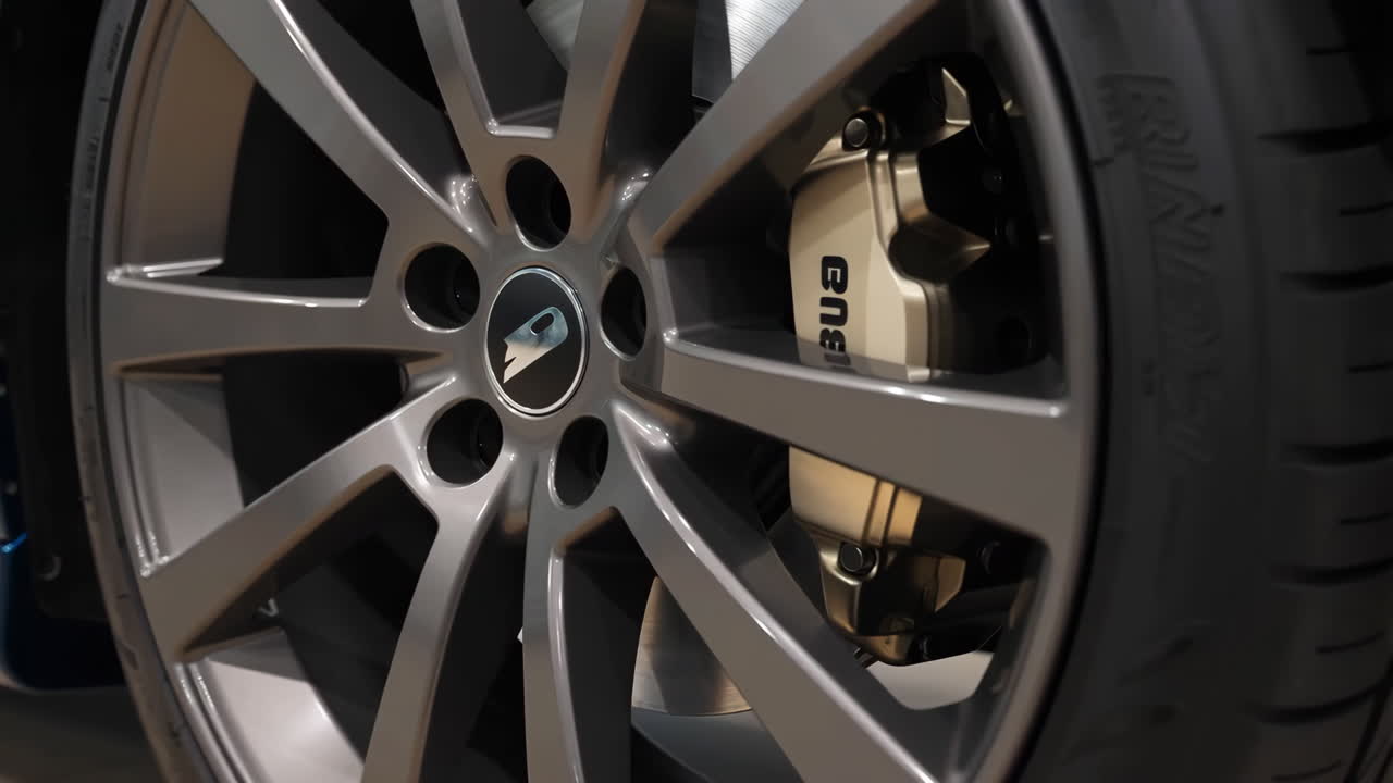 Close-up of a Car Wheel, Tire, and Brake Caliper