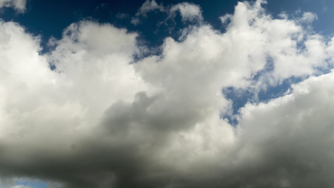 Timelapse of white and grey clouds with blue sky above Melbourne