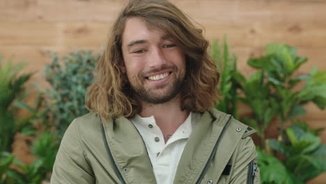 portrait of relaxed young caucasian man smiling happy at camera enjoying carefree lifestyle