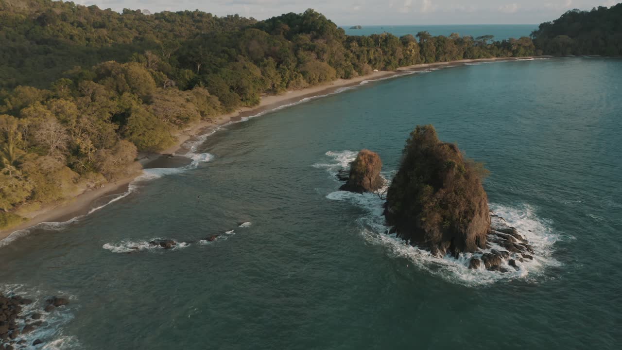 Drone aerial view of a beach and sea stacks in a national park, Manuel Antonio, Quepos, Costa rica