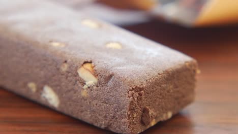 close-up of a chocolate-covered almond bar