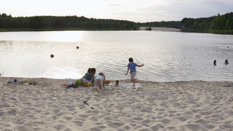 family having picnic on the beach