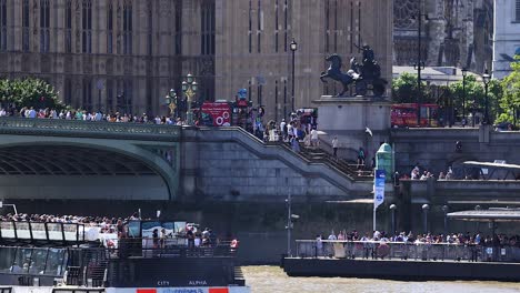 boat cruising past westminster with tourists onboard