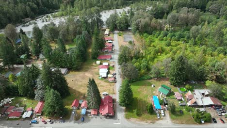 Aerial-shot-tilting-up-from-the-main-grocery-store-in-Baring,-Washington-to-reveal-how-desolate-the-town-is