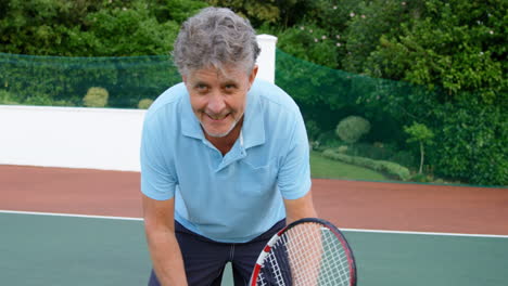 senior man playing tennis in tennis court 4k