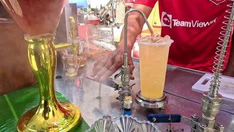 bartender creates a dramatic smoky cocktail.