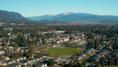 aerial view of a baseball diamond in an idyllic mountainside community