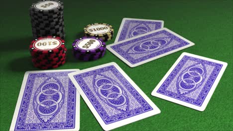 cards dealt onto a poker table with piles of gambling chips - poker hands - five cards dealt face down with blue patterned backs