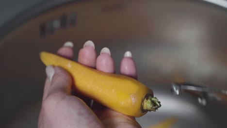 women's hands wash, peel and cut vegetables into vegetable stew