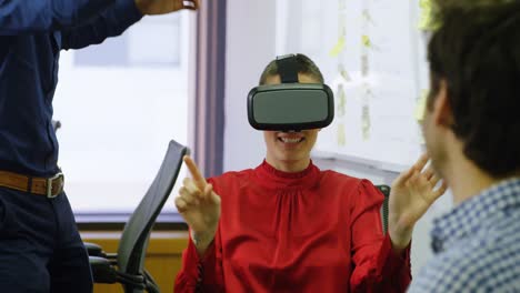 Executive-using-virtual-reality-headset-at-desk-4k