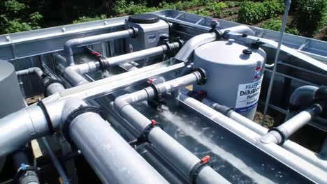 an overview of advanced water filtration system featuring complex plumbing, tanks, and diligent water flow mechanism in a sustainable environment