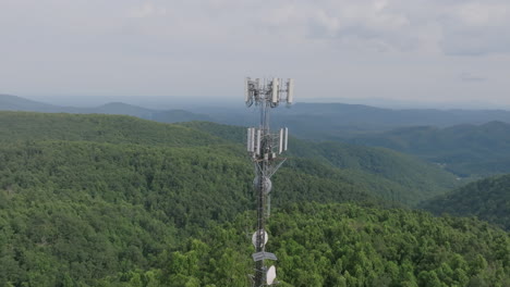 aerial footage of a cell tower in rural mountainous virginia