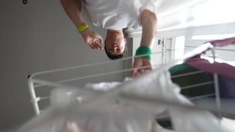 person drying clothes upside down