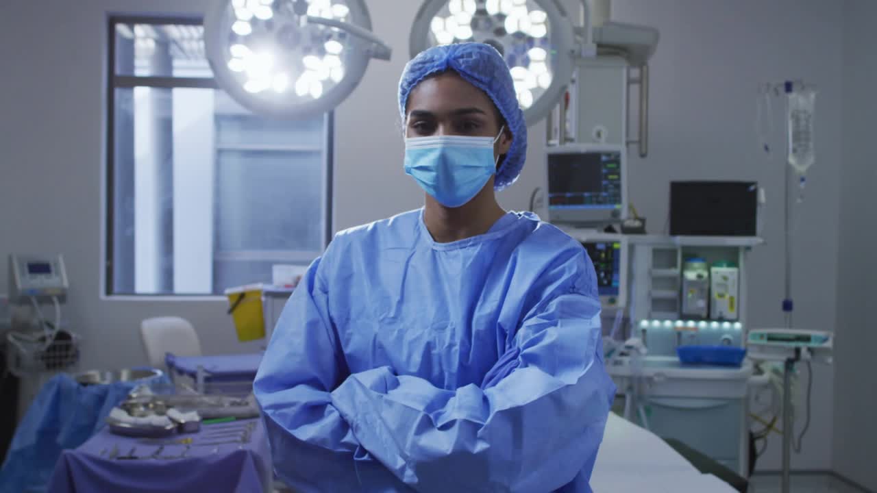Surgeon standing in operating room starting code overlays intensifying medical data visualization