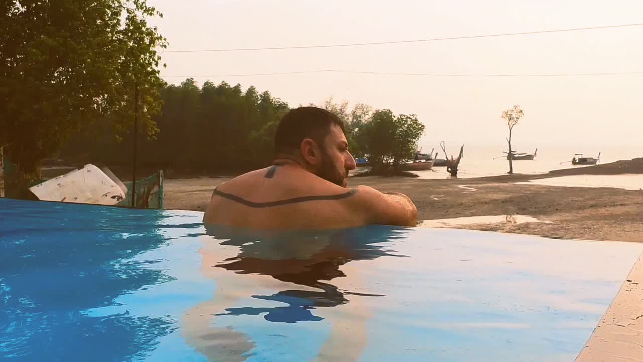 contemplating the landscape in the infinity pool