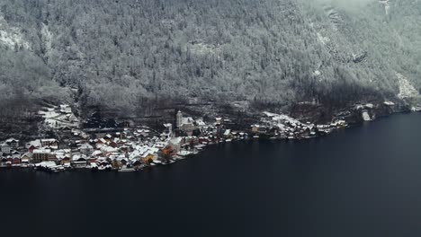 Footage-filmed-with-a-drone-over-a-lake-by-a-town-called-Hallstatt-in-Austria-in-Europe