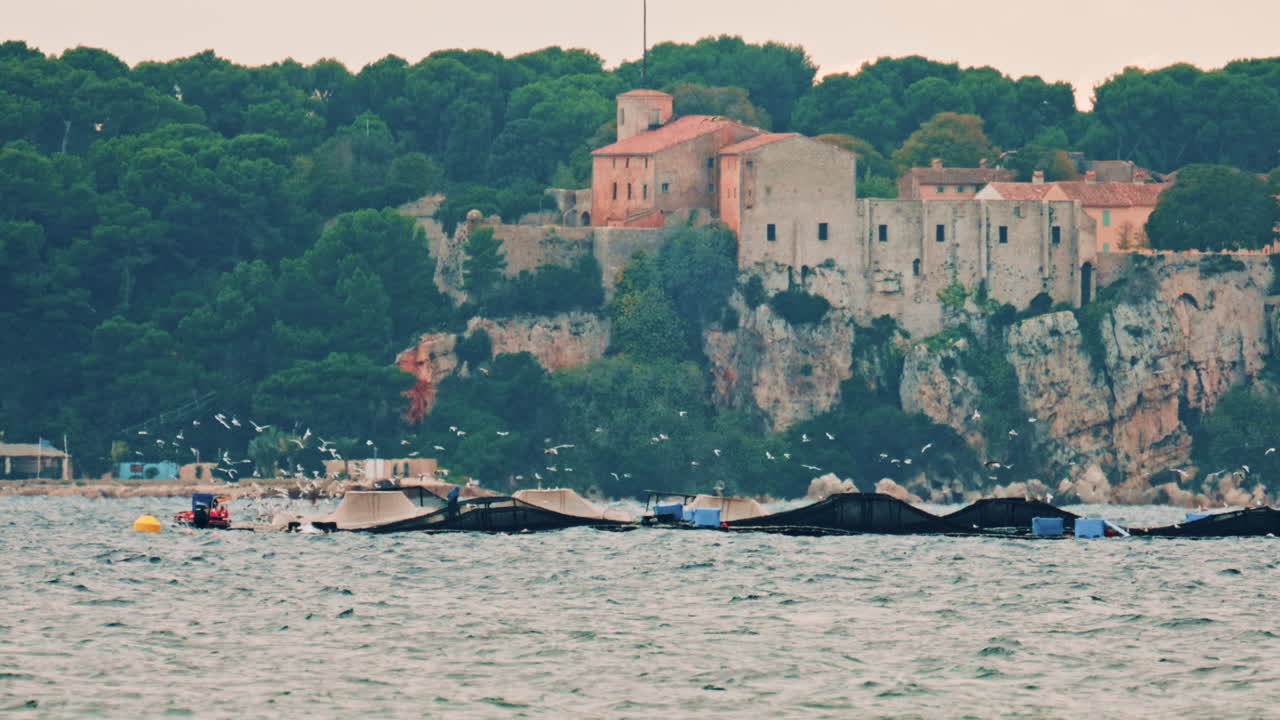 View of a historic stone fortress on a rocky Mediterranean island near Cannes on the French Riviera