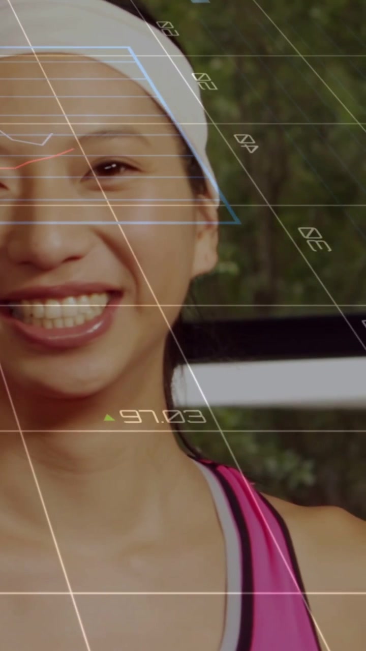 Vertical video: Fitness woman nodding, activating HUD with pie charts and numbers, camera panning