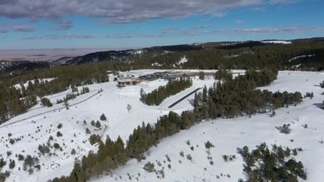 mountaintop ski lodge in the winter with snow