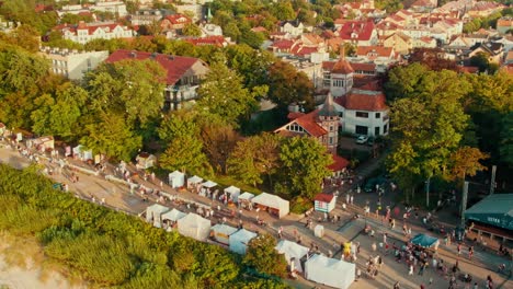 people walking on the promanade in setting sun