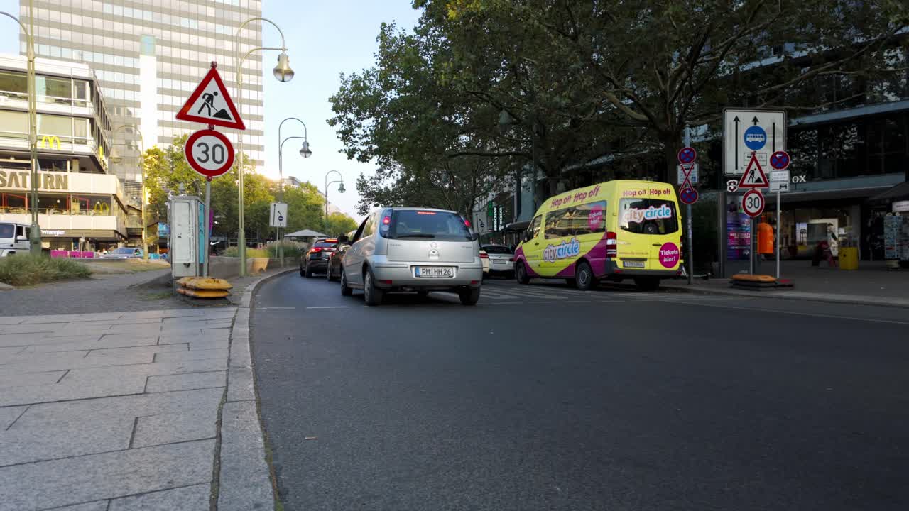 Cars Stopping At Traffic On City Street In Berlin, Germany In Daytime. wide shot