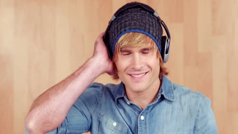 hipster listening to music and smiling