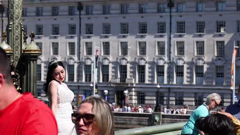 woman in white dress posing by the river