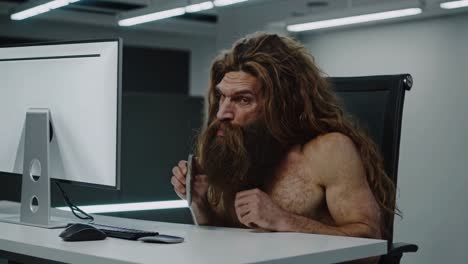 caveman in a modern office