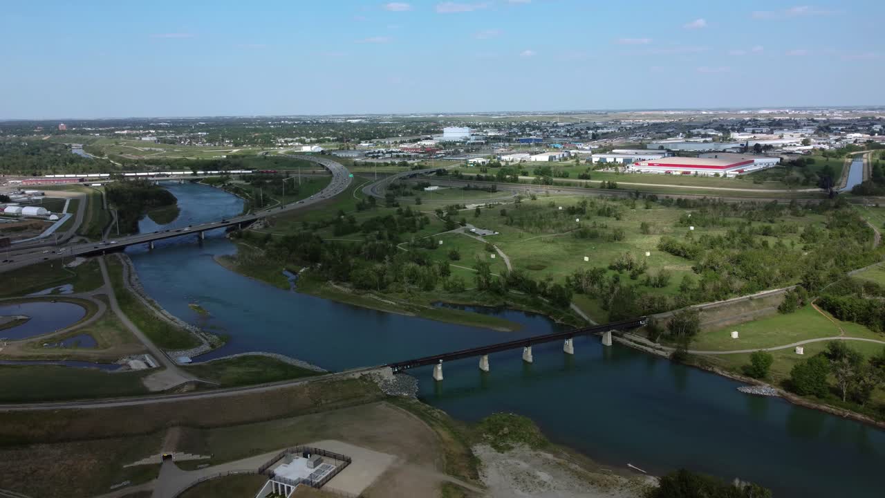 Scenic summer aerial footage of Calgary's Deerfoot highway and Bow River
