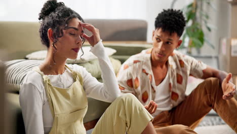 A couple having a serious conversation in their living room