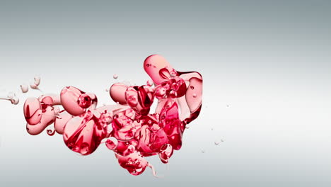 transparent red oil bubbles and fluid shapes in purified water on a white gradient background