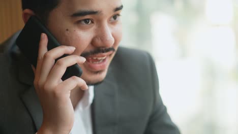 slow motion scene adult middle east businessman use smartphone to call and talk with partner or colleagues to advice and consult about work for lifestyle business concept