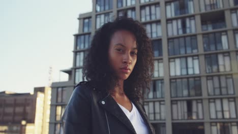 fashionable young woman on urban rooftop