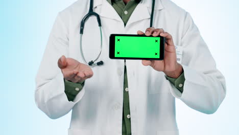 Doctor,-hands-and-green-screen-of-phone-in-studio