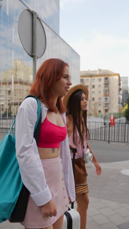 two young women walking in the city