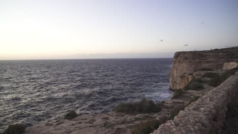 Purple-Sunset-Paints-the-Sky-with-Beautiful-Colour-near-Mediterranean-Sea-in-Malta